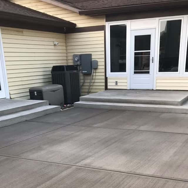 Broom-finished patio and steps outside a home's sunroom — JFC Concrete LLC, Indianapolis, IN