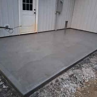 Smooth-finished garage floor slab at the door of a metal building — JFC Concrete LLC, Indianapolis, IN